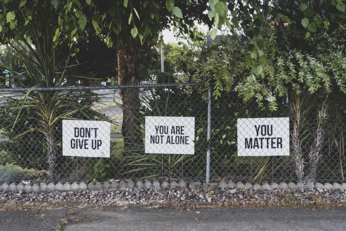 Signs on a fence